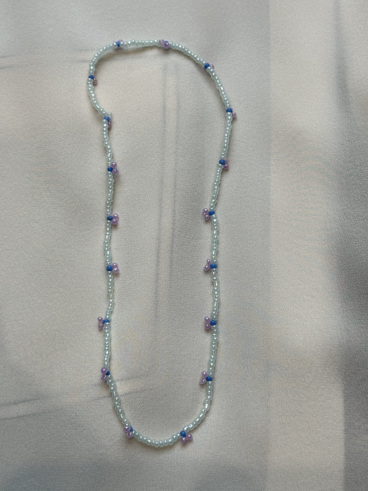 Pearl Necklace in gray with purple berries
